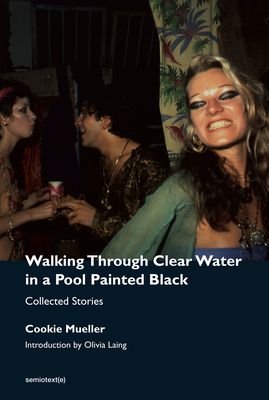 Walking through clear water in a pool painted black